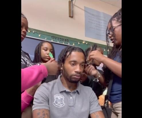 students unbraiding teachers hair